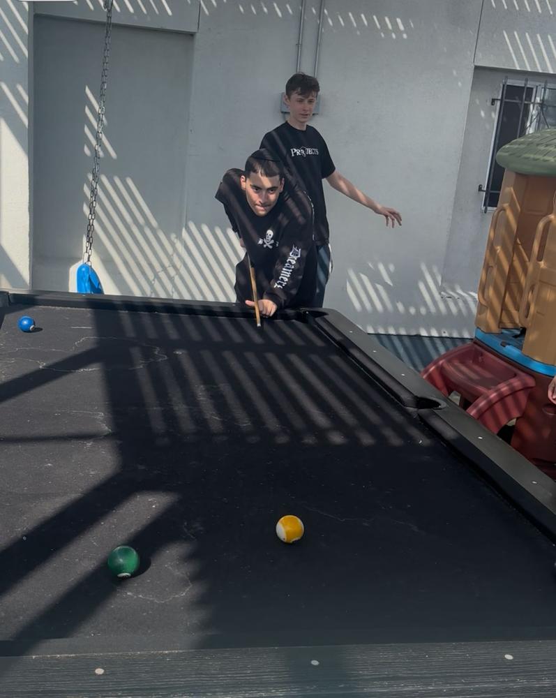 Students playing pool